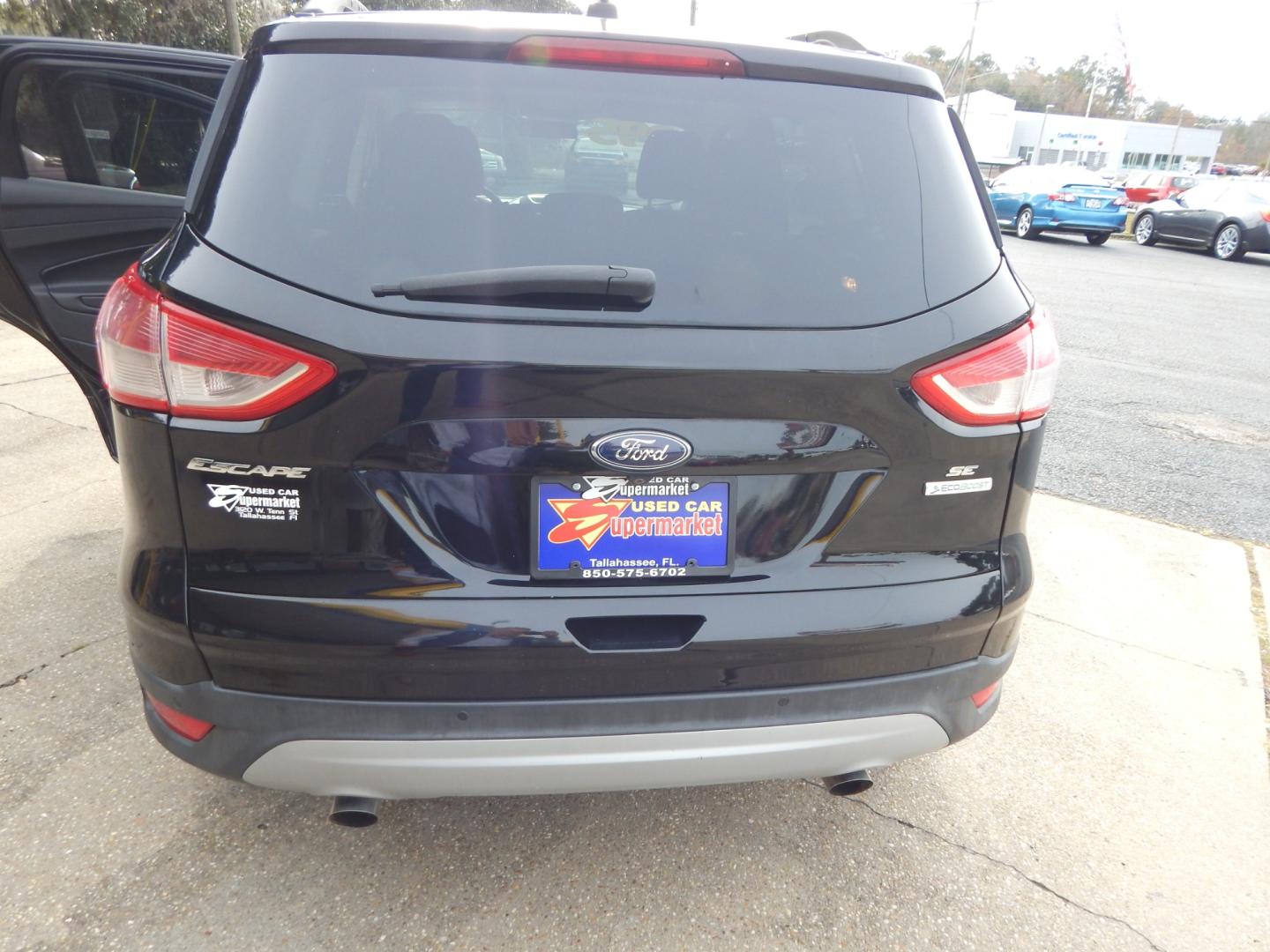 2016 Black /Gray Ford Escape SE (1FMCU0GXXGU) with an 1.6l engine, Automatic transmission, located at 3120 W Tennessee St, Tallahassee, FL, 32304-1002, (850) 575-6702, 30.458841, -84.349648 - Used Car Supermarket is proud to present you with this loaded immaculate 2016 Ford Escape SE. Used Car Supermarket prides itself in offering you the finest pre-owned vehicle in Tallahassee. Used Car Supermarket has been locally family owned and operated for over 48 years. Our Escape SE has been serv - Photo#3